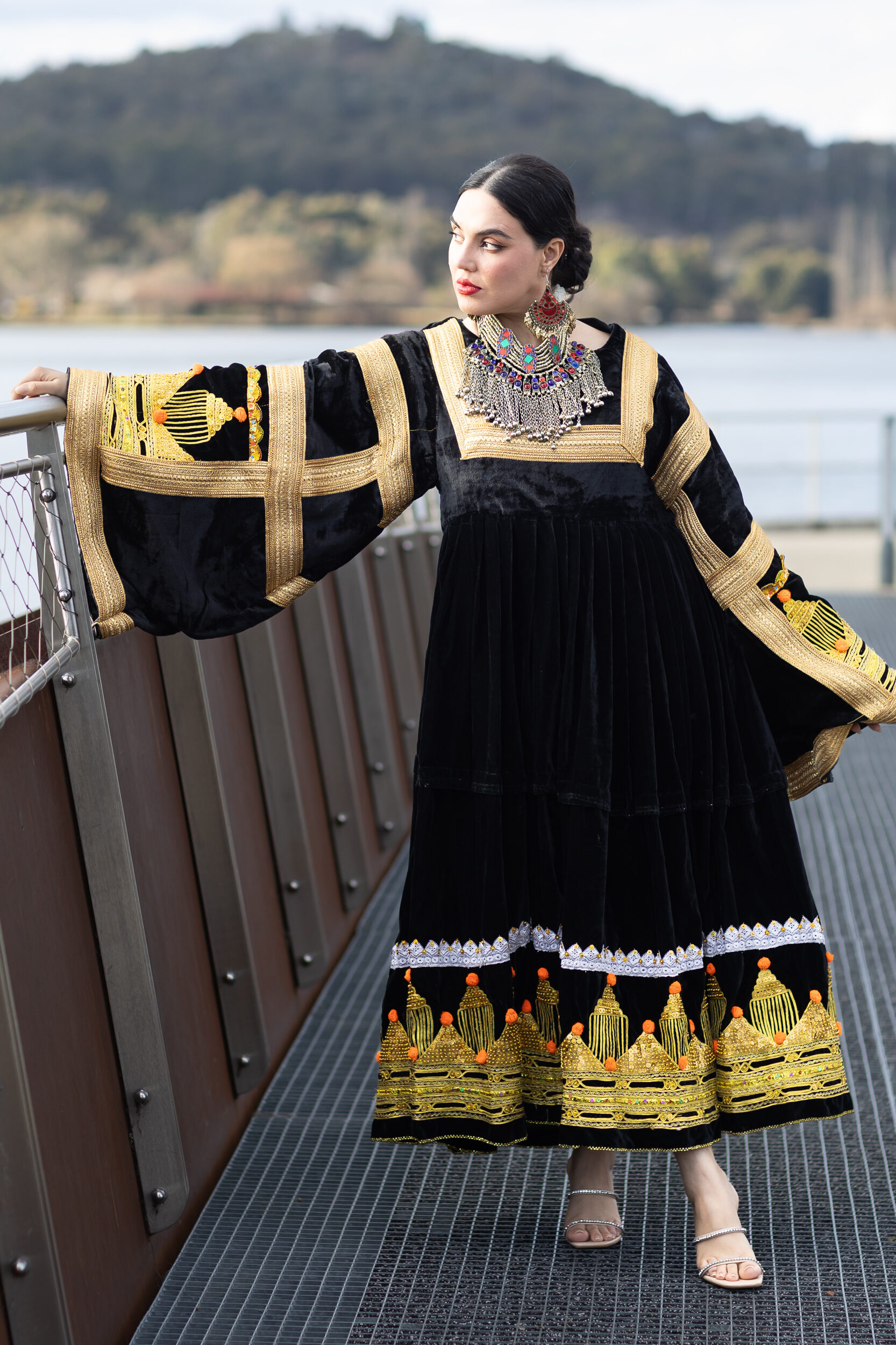 Woman wearing Afghan-inspired RAAZ brand dress, at Kingston, Canberra