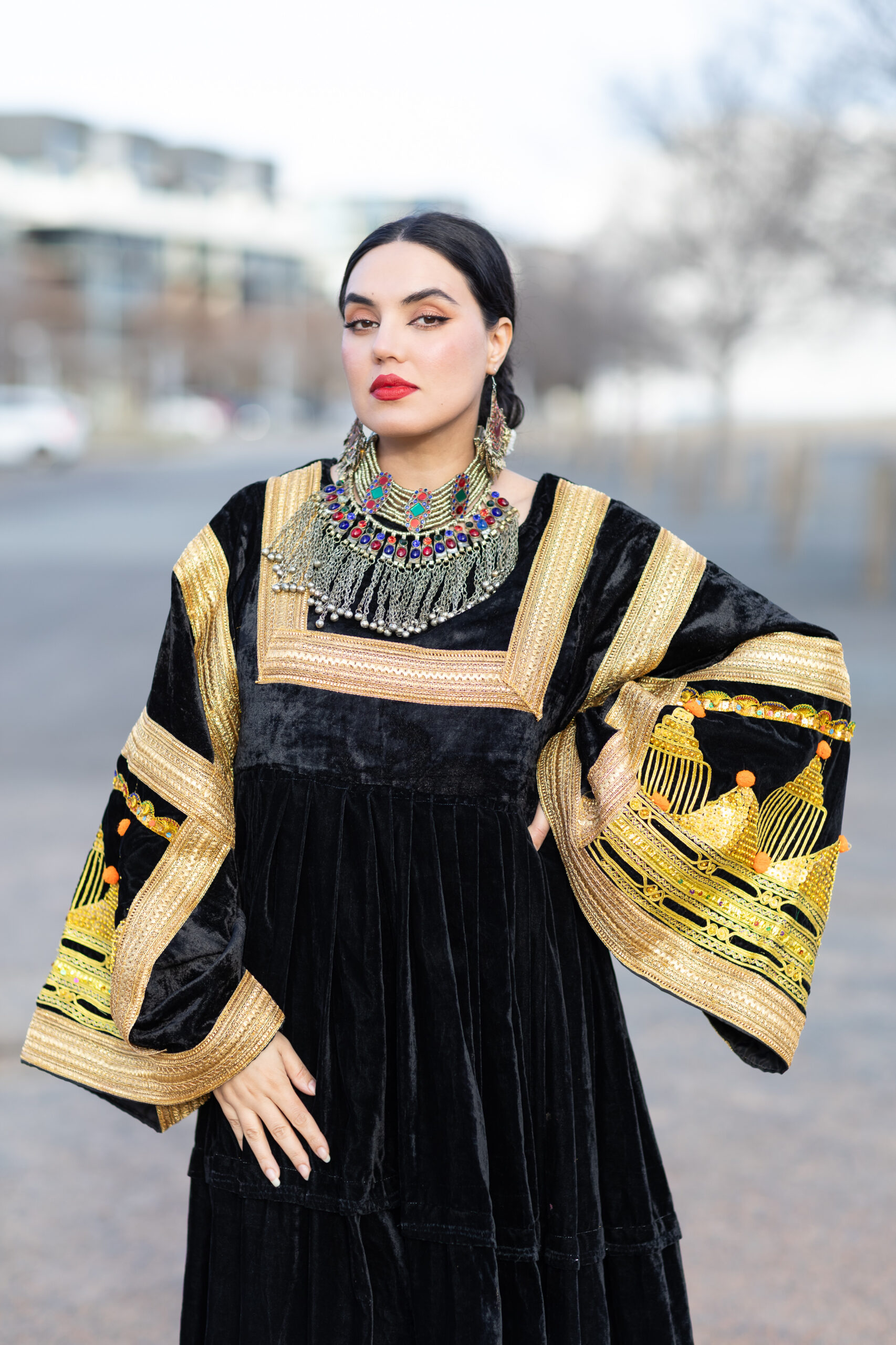 Woman wearing Afghan-inspired fashion in Canberra, looking at camera