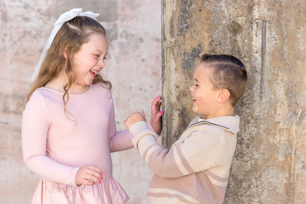 Kids laughing at each other during a photo session at Mt Stromlo Canberra